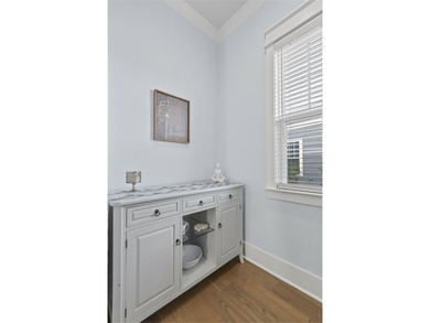 Welcome home to this light-filled coastal retreat tucked inside on Dunes West Golf Club in South Carolina - for sale on GolfHomes.com, golf home, golf lot