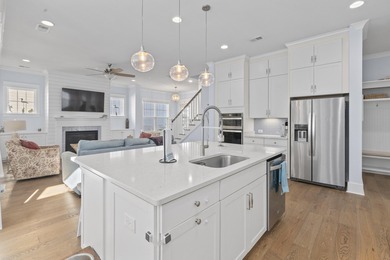 Welcome home to this light-filled coastal retreat tucked inside on Dunes West Golf Club in South Carolina - for sale on GolfHomes.com, golf home, golf lot