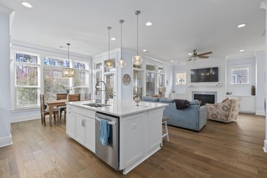 Welcome home to this light-filled coastal retreat tucked inside on Dunes West Golf Club in South Carolina - for sale on GolfHomes.com, golf home, golf lot