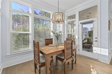 Welcome home to this light-filled coastal retreat tucked inside on Dunes West Golf Club in South Carolina - for sale on GolfHomes.com, golf home, golf lot