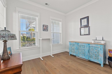 Welcome home to this light-filled coastal retreat tucked inside on Dunes West Golf Club in South Carolina - for sale on GolfHomes.com, golf home, golf lot