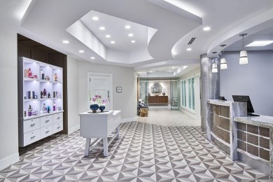 Welcome to this exceptionally renovated 3-bedroom, 2-bathroom on Wycliffe Golf and Country Club in Florida - for sale on GolfHomes.com, golf home, golf lot