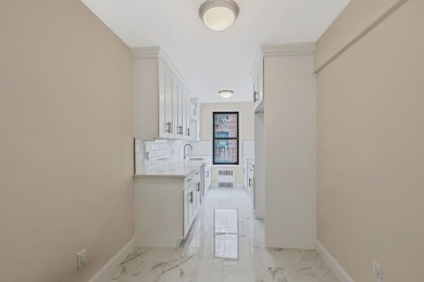 Fully renovated two-bedroom, one-bathroom end unit with elevator on Forest Park Golf Course in New York - for sale on GolfHomes.com, golf home, golf lot