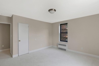 Fully renovated two-bedroom, one-bathroom end unit with elevator on Forest Park Golf Course in New York - for sale on GolfHomes.com, golf home, golf lot