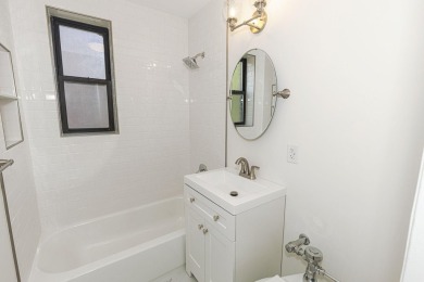 Fully renovated two-bedroom, one-bathroom end unit with elevator on Forest Park Golf Course in New York - for sale on GolfHomes.com, golf home, golf lot