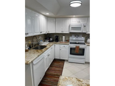 EXPERIENCE THE LUXURY LIVING IN THIS LARGE AND CAPTIVATING 2 BED on Jim McLean Signature Course in Florida - for sale on GolfHomes.com, golf home, golf lot