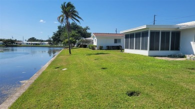Waterfront GEM! This Mainlands home offers 2 bedrooms, 1 on Mainlands Golf Club in Florida - for sale on GolfHomes.com, golf home, golf lot