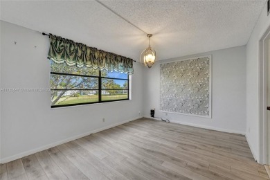 MUST SEE MOVE-IN READY, SPECTACULAR GOLF COURSE VIEWS, 2ND FLOOR on Oriole Golf and Tennis Club in Florida - for sale on GolfHomes.com, golf home, golf lot