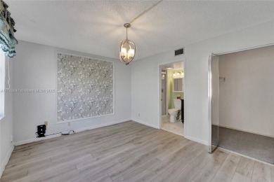 MUST SEE MOVE-IN READY, SPECTACULAR GOLF COURSE VIEWS, 2ND FLOOR on Oriole Golf and Tennis Club in Florida - for sale on GolfHomes.com, golf home, golf lot
