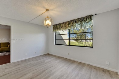 MUST SEE MOVE-IN READY, SPECTACULAR GOLF COURSE VIEWS, 2ND FLOOR on Oriole Golf and Tennis Club in Florida - for sale on GolfHomes.com, golf home, golf lot