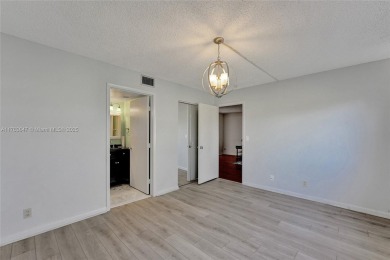 MUST SEE MOVE-IN READY, SPECTACULAR GOLF COURSE VIEWS, 2ND FLOOR on Oriole Golf and Tennis Club in Florida - for sale on GolfHomes.com, golf home, golf lot