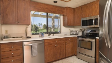 Nestled in the highly sought-after gated community of Palm on Palm Desert Resort Country Club in California - for sale on GolfHomes.com, golf home, golf lot