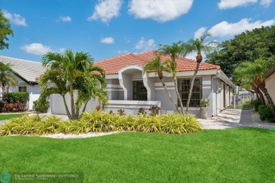 Nestled in the heart of Boca Woods Country Club, this renovated on Boca Woods Country Club in Florida - for sale on GolfHomes.com, golf home, golf lot