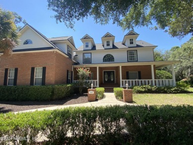 Large 2-story mostly brick home in serene Hidden Hills. Situated on Hidden Hills Country Club in Florida - for sale on GolfHomes.com, golf home, golf lot