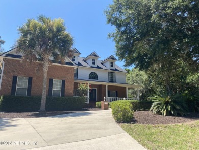 Large 2-story mostly brick home in serene Hidden Hills. Situated on Hidden Hills Country Club in Florida - for sale on GolfHomes.com, golf home, golf lot