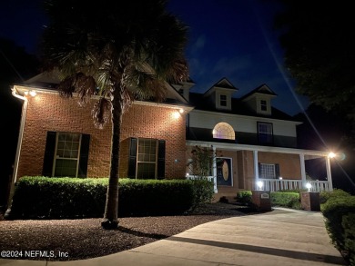 Large 2-story mostly brick home in serene Hidden Hills. Situated on Hidden Hills Country Club in Florida - for sale on GolfHomes.com, golf home, golf lot