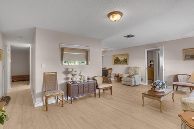 Welcome to this beautifully maintained 2-bedroom, 2-bath on Leisureville Community Golf Course in Florida - for sale on GolfHomes.com, golf home, golf lot