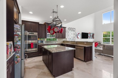 Step onto this stunning contemporary 5B/4Full BA/3 car gar on PGA National Estates Golf Course in Florida - for sale on GolfHomes.com, golf home, golf lot