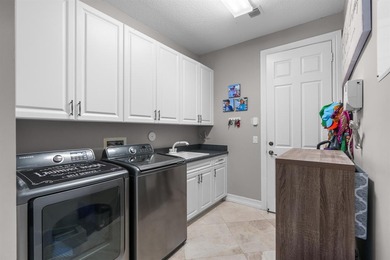 Step onto this stunning contemporary 5B/4Full BA/3 car gar on PGA National Estates Golf Course in Florida - for sale on GolfHomes.com, golf home, golf lot