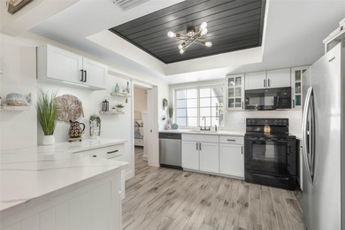 Step inside and exhale--from morning coffee by the pool to on Palm Harbor Golf Club in Florida - for sale on GolfHomes.com, golf home, golf lot