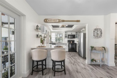 Step inside and exhale--from morning coffee by the pool to on Palm Harbor Golf Club in Florida - for sale on GolfHomes.com, golf home, golf lot