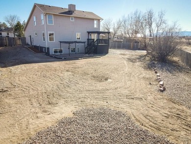 This spacious 2-story home offers 2,354 sq ft with 5 bedrooms, 3 on Desert Hawk At Pueblo West in Colorado - for sale on GolfHomes.com, golf home, golf lot