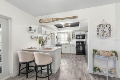 Step inside and exhale--from morning coffee by the pool to on Palm Harbor Golf Club in Florida - for sale on GolfHomes.com, golf home, golf lot