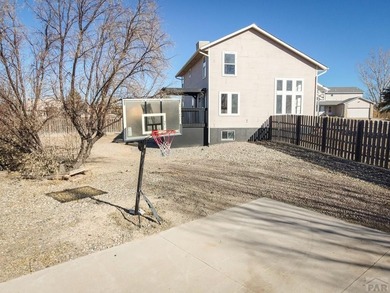This spacious 2-story home offers 2,354 sq ft with 5 bedrooms, 3 on Desert Hawk At Pueblo West in Colorado - for sale on GolfHomes.com, golf home, golf lot