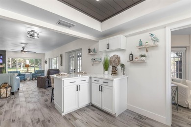 Step inside and exhale--from morning coffee by the pool to on Palm Harbor Golf Club in Florida - for sale on GolfHomes.com, golf home, golf lot