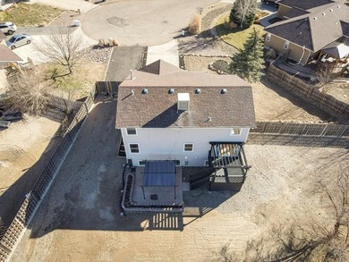 This spacious 2-story home offers 2,354 sq ft with 5 bedrooms, 3 on Desert Hawk At Pueblo West in Colorado - for sale on GolfHomes.com, golf home, golf lot