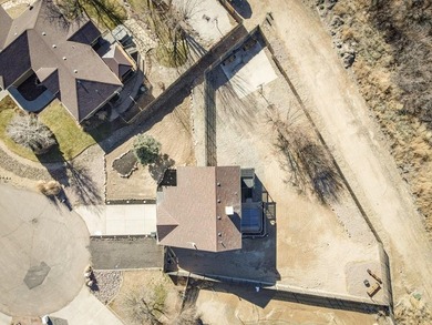 This spacious 2-story home offers 2,354 sq ft with 5 bedrooms, 3 on Desert Hawk At Pueblo West in Colorado - for sale on GolfHomes.com, golf home, golf lot