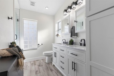 Step inside and exhale--from morning coffee by the pool to on Palm Harbor Golf Club in Florida - for sale on GolfHomes.com, golf home, golf lot