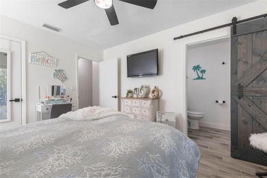 Step inside and exhale--from morning coffee by the pool to on Palm Harbor Golf Club in Florida - for sale on GolfHomes.com, golf home, golf lot