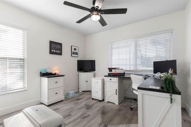 Step inside and exhale--from morning coffee by the pool to on Palm Harbor Golf Club in Florida - for sale on GolfHomes.com, golf home, golf lot