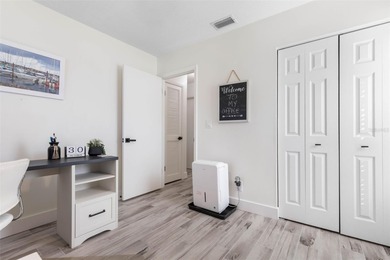 Step inside and exhale--from morning coffee by the pool to on Palm Harbor Golf Club in Florida - for sale on GolfHomes.com, golf home, golf lot