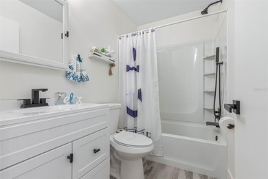 Step inside and exhale--from morning coffee by the pool to on Palm Harbor Golf Club in Florida - for sale on GolfHomes.com, golf home, golf lot