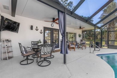 Step inside and exhale--from morning coffee by the pool to on Palm Harbor Golf Club in Florida - for sale on GolfHomes.com, golf home, golf lot