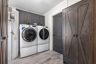 Step inside and exhale--from morning coffee by the pool to on Palm Harbor Golf Club in Florida - for sale on GolfHomes.com, golf home, golf lot