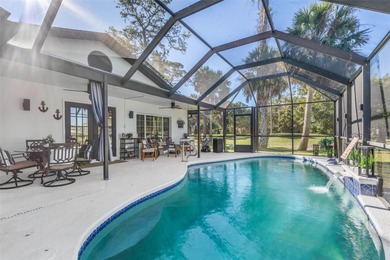Step inside and exhale--from morning coffee by the pool to on Palm Harbor Golf Club in Florida - for sale on GolfHomes.com, golf home, golf lot