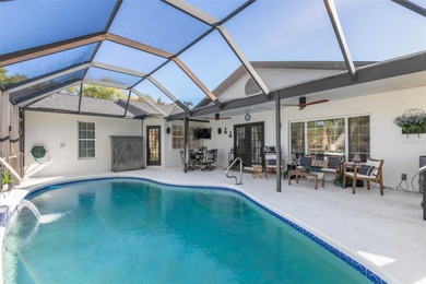 Step inside and exhale--from morning coffee by the pool to on Palm Harbor Golf Club in Florida - for sale on GolfHomes.com, golf home, golf lot