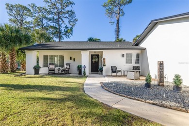 Step inside and exhale--from morning coffee by the pool to on Palm Harbor Golf Club in Florida - for sale on GolfHomes.com, golf home, golf lot