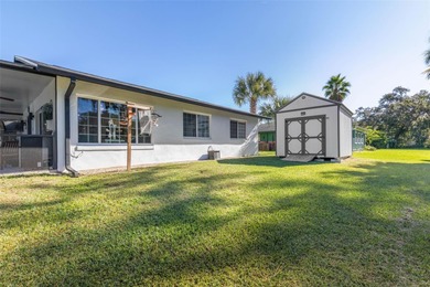 Step inside and exhale--from morning coffee by the pool to on Palm Harbor Golf Club in Florida - for sale on GolfHomes.com, golf home, golf lot