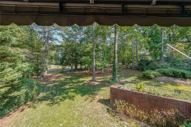 Welcome home to this beautiful 3-sided brick home situated on on Brookstone Golf and Country Club in Georgia - for sale on GolfHomes.com, golf home, golf lot