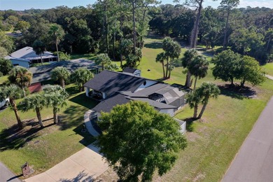 Step inside and exhale--from morning coffee by the pool to on Palm Harbor Golf Club in Florida - for sale on GolfHomes.com, golf home, golf lot