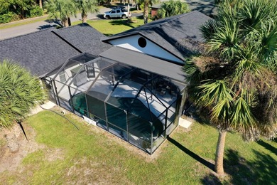 Step inside and exhale--from morning coffee by the pool to on Palm Harbor Golf Club in Florida - for sale on GolfHomes.com, golf home, golf lot