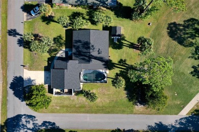 Step inside and exhale--from morning coffee by the pool to on Palm Harbor Golf Club in Florida - for sale on GolfHomes.com, golf home, golf lot
