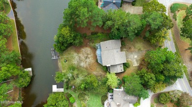 Lake front on Lake Pinehurst! 1050 Burning Tree, tucked back in on Pinehurst Resort and Country Club in North Carolina - for sale on GolfHomes.com, golf home, golf lot