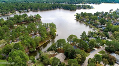 Lake front on Lake Pinehurst! 1050 Burning Tree, tucked back in on Pinehurst Resort and Country Club in North Carolina - for sale on GolfHomes.com, golf home, golf lot