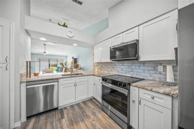 What a *WOW* when you walk into this beautifully updated villa on University Park Country Club in Florida - for sale on GolfHomes.com, golf home, golf lot