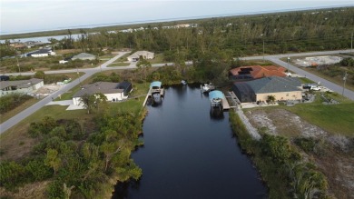 This exceptional WATERFRONT lot in South Gulf Cove offers direct on Rotonda Golf and Country Club - Long Marsh  in Florida - for sale on GolfHomes.com, golf home, golf lot